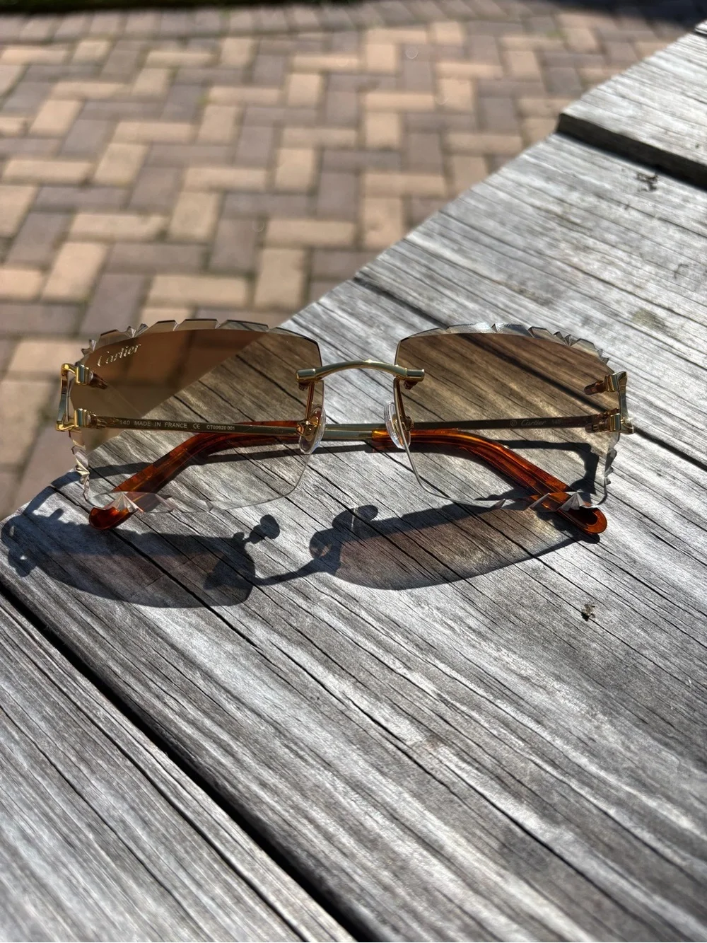Cartier Men's Rimless Sunglasses with Gold Frame and Brown Lenses